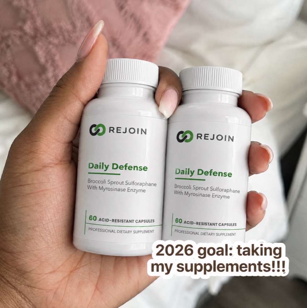 Sierra holding two bottles of Rejoin Daily Defense